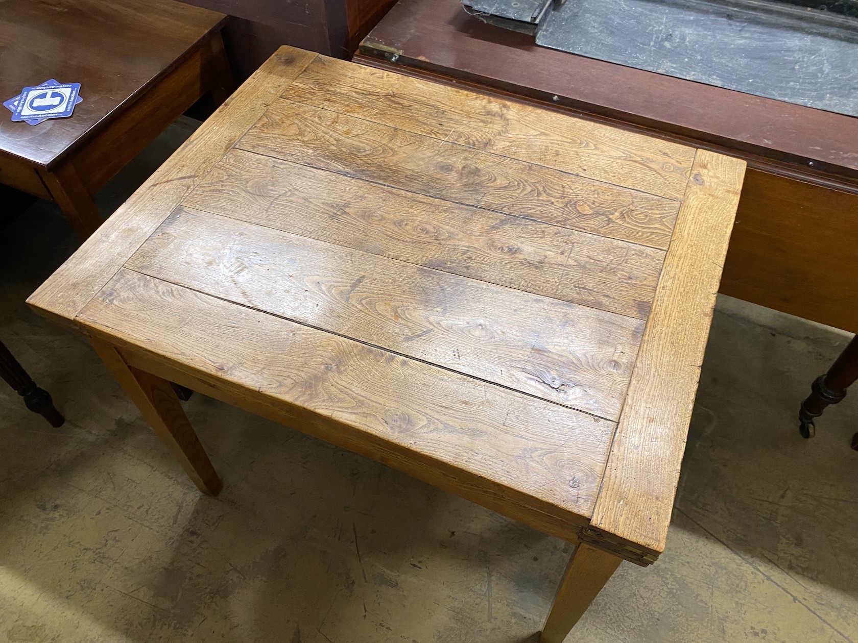 A 19th century French provincial oak farmhouse table with rectangular folding top on square tapered legs, 176cm extended, depth 69cm, height 74cm